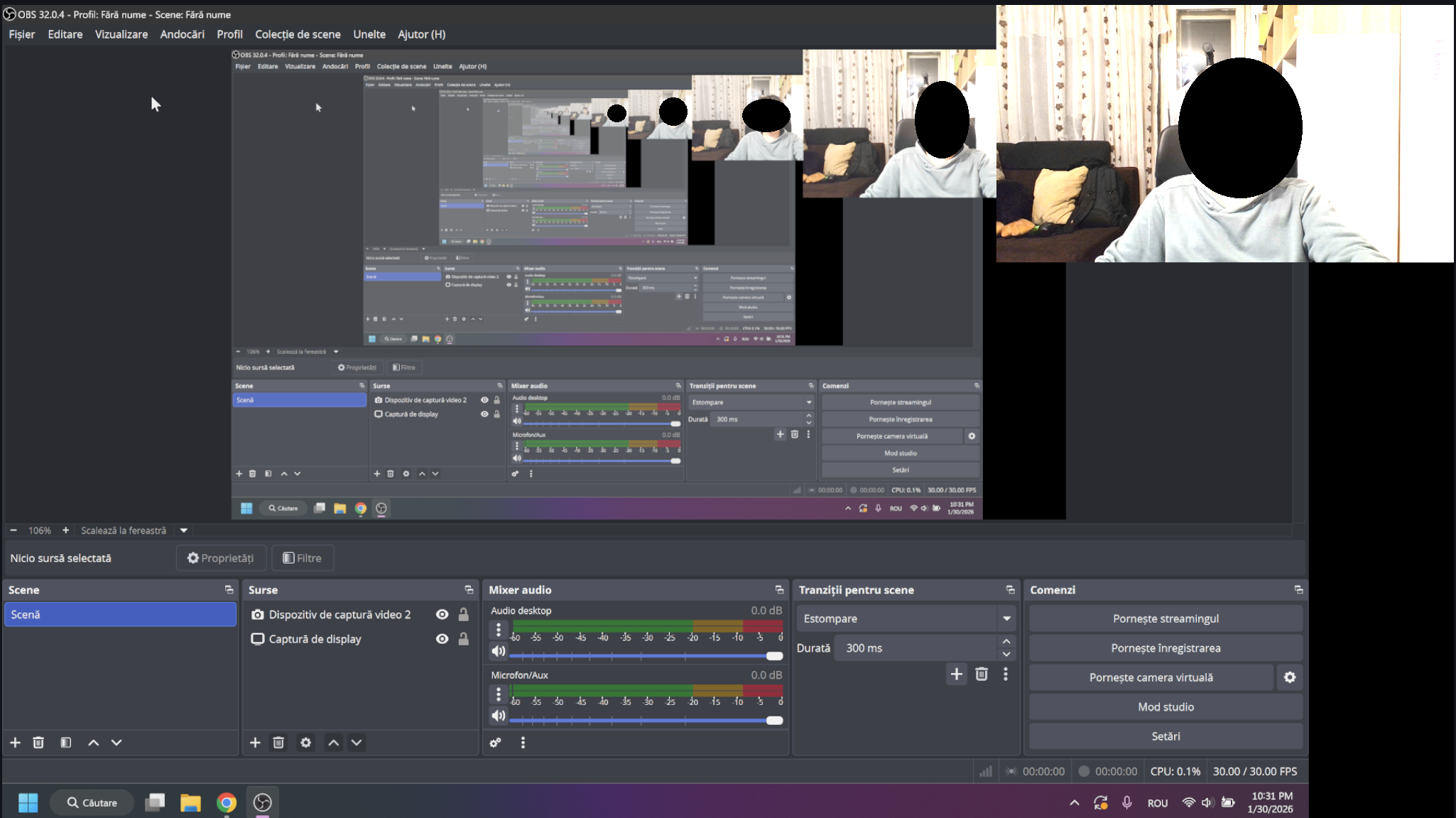 În imagine se află un program de înregistrare a ecranului. Se poate vedea ecranul însuși, iar în colțul din dreapta sus, o fereastră cu o înregistrare folosind camera laptopului